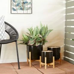Litton Lane 13 in., 11 in., 10 in. Black Stoneware Contemporary Planter (Set of 3) -Litton Lane Sales Store glossy black litton lane plant pots 040492 31 1000